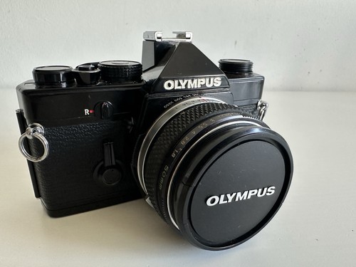 Olympus black zuiko - black,